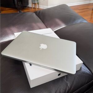 Apple Silver MacBook Laptop with Apple Logo